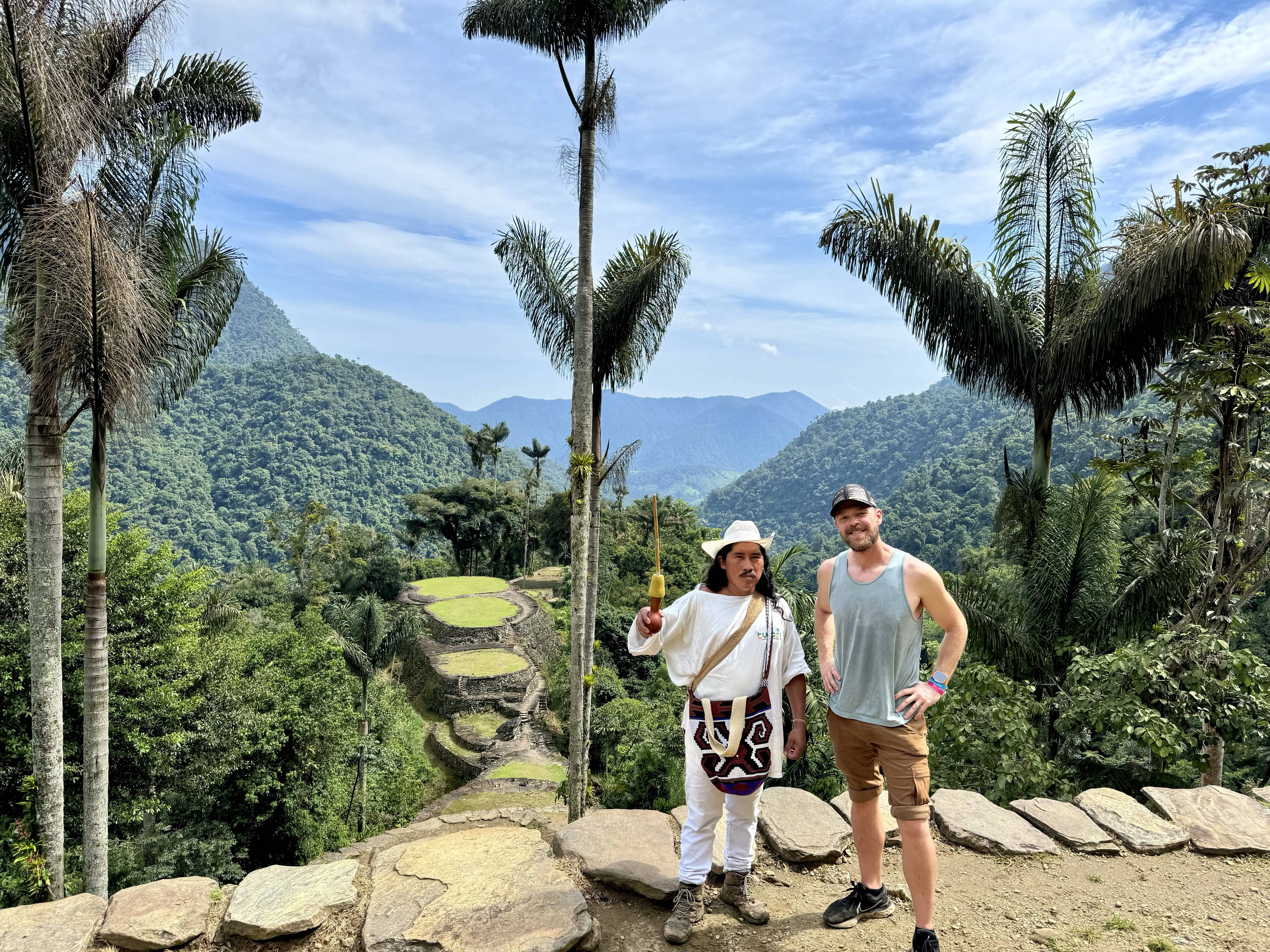 Joseph Kiske standing with a local guide in the Colombian mountains