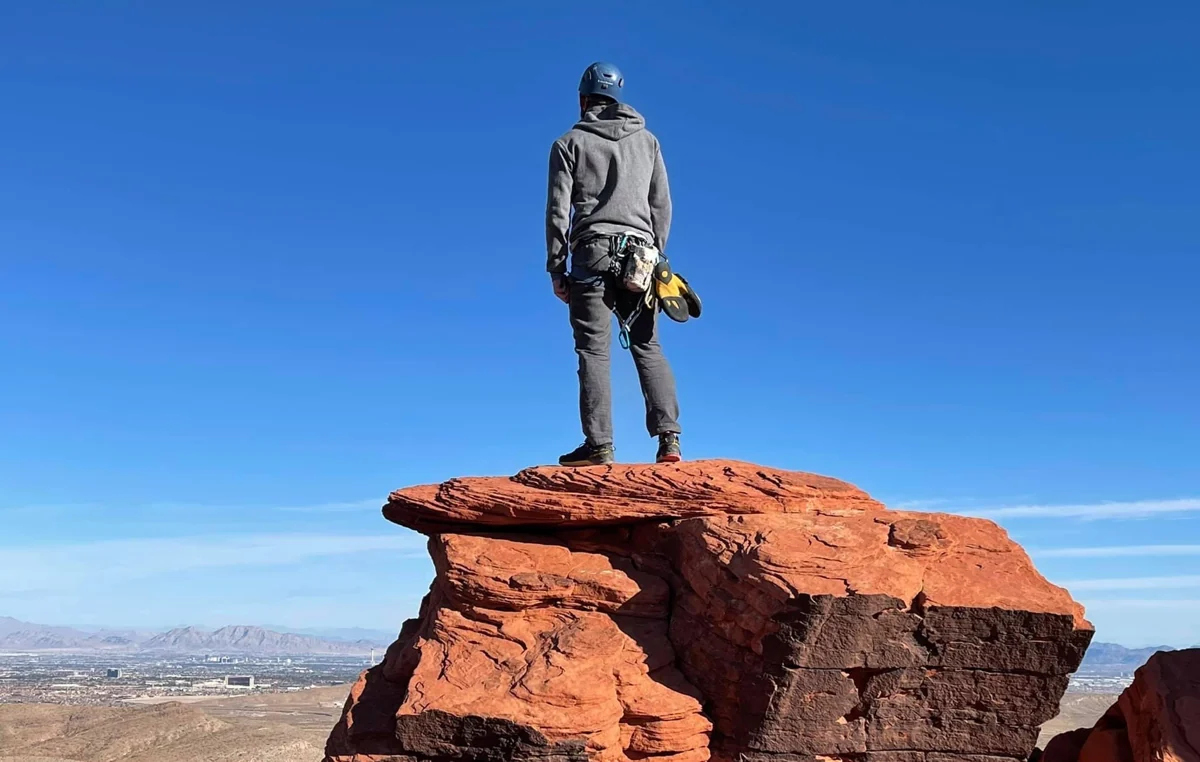 Joseph overlooking the Nevada landscape from a sandstone summit at Red Rocks